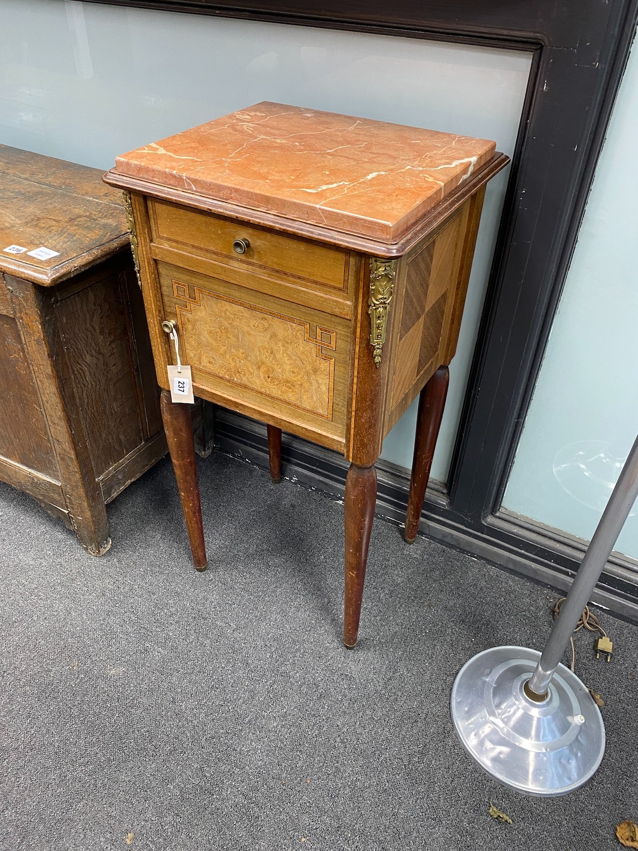 An early 20th century French banded bird's eye maple marble topped bedside cabinet, width 43cm, depth 39cm, height 86cm